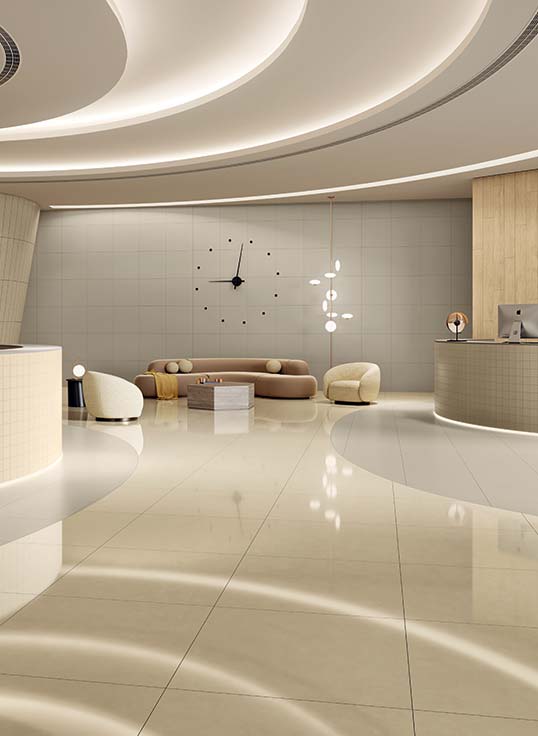 Lobby de bureaux tertiaires haut de gamme avec carrelage grand format et aménagement architectural contemporain