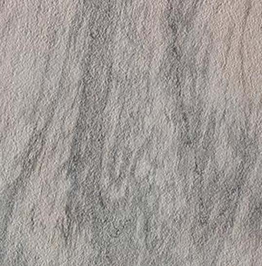 Texture minérale du carrelage de façade en grès cérame Texture de carrelage de façade en grès cérame clair utilisé sur l’Opéra de Florence, finition minérale et mate