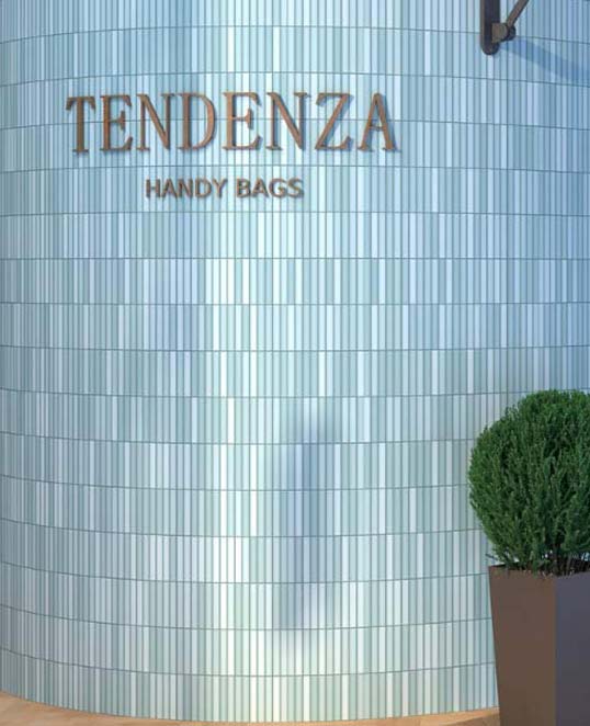 Façade céramique en relief vertical effet mosaïque contemporain Façade commerciale habillée de carreaux céramiques verticaux effet mosaïque créant un relief lumineux et dynamique